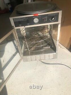 Gold Medal pizza warmer. Holds 4 18 inch pizzas. Comes with four pans