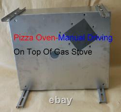 Portable pizza oven on top of gas stove